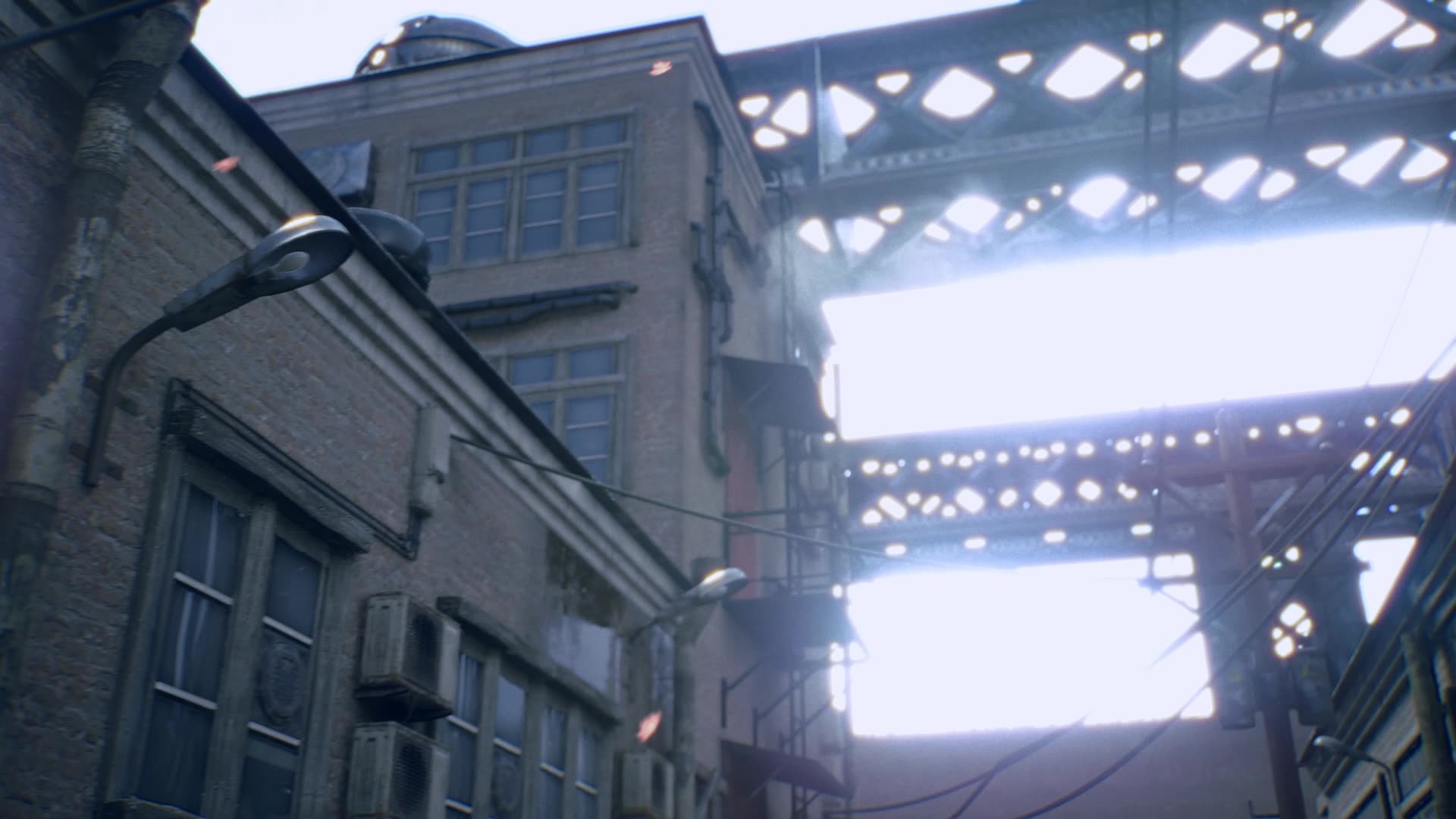 Brick buildings and street lamps under industrial bridges