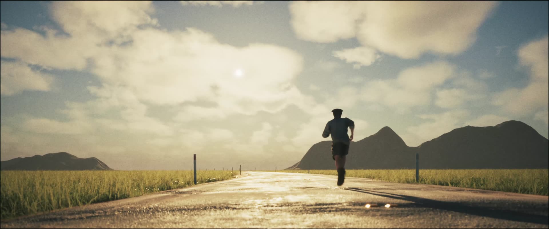A runner on a wet road heading towards mountains