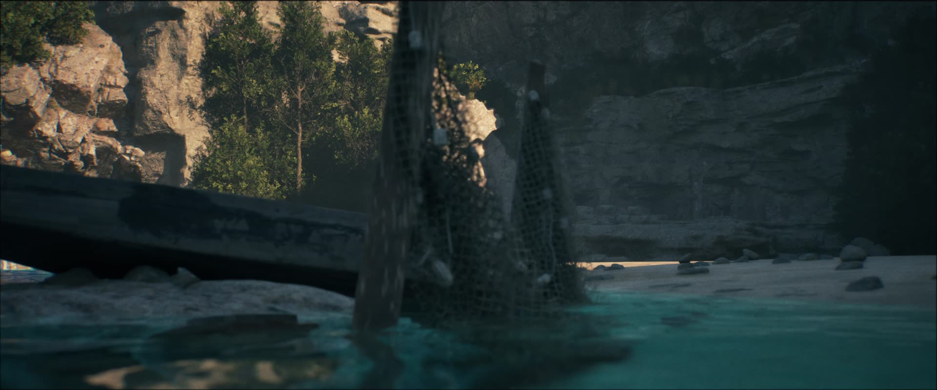 A wooden boat wreck in a shallow cove